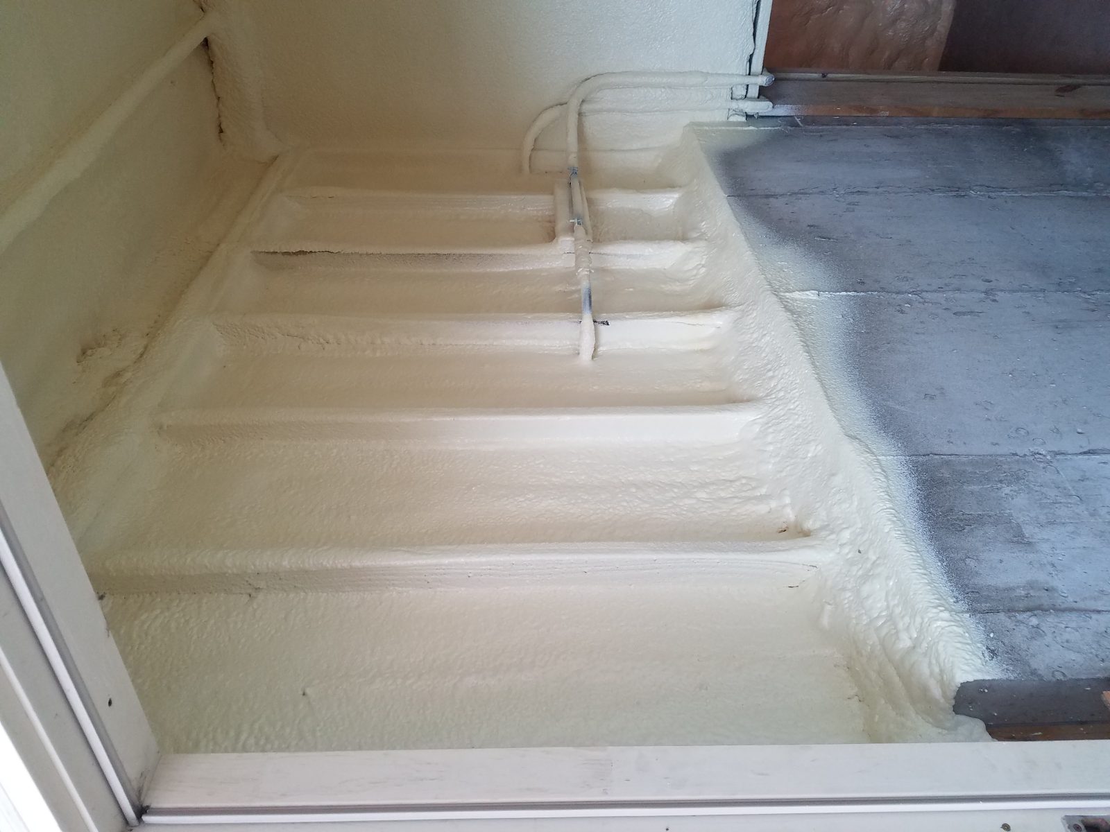 Foam insulation application on a wall assembly